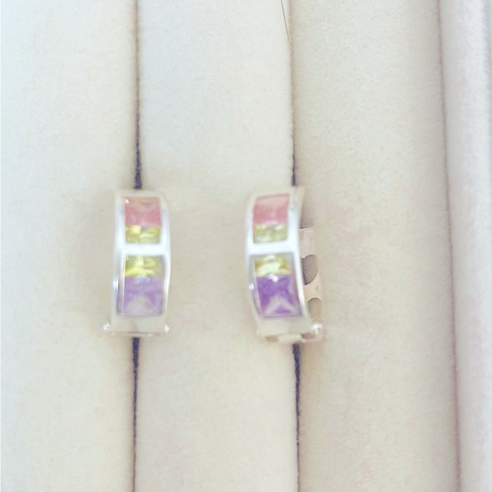 925 Guaranteed Sterling Silver hoop earrings with pink and purple stones.